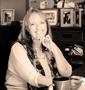 Carolyn, owner of Clear Expressions, sitting at her desk